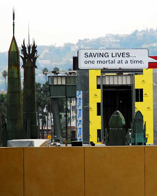 Sign above the Chinese Theater on Hollywood Boulevard - "Saving Lives, One Mortal at a Time"