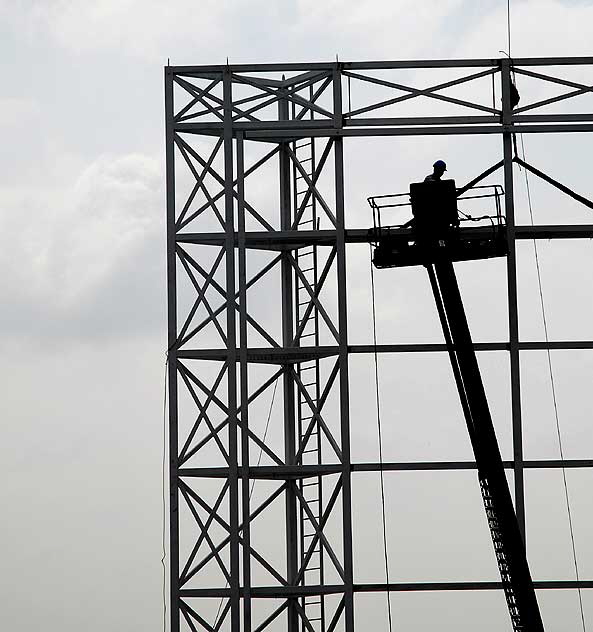 Billboard scaffolding under construction above the old Masonic Hall, Hollywood Boulevard