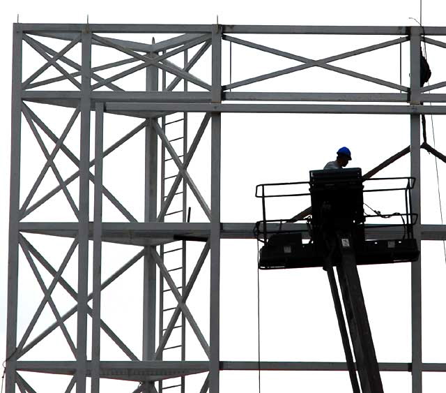 Billboard scaffolding under construction above the old Masonic Hall, Hollywood Boulevard