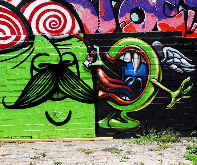 Mysterious men and their mysterious moustaches - mural in alley at Melrose and Spaulding, Hollywood