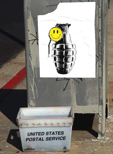 Grenade and Smiley Face, graphic on utility box