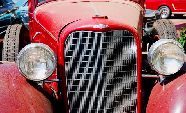 Red Lincoln in a repair lot on the northwest corner of Robertson and Charleville at the edge of Beverly Hills