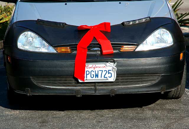 Christmas bow on California Ford